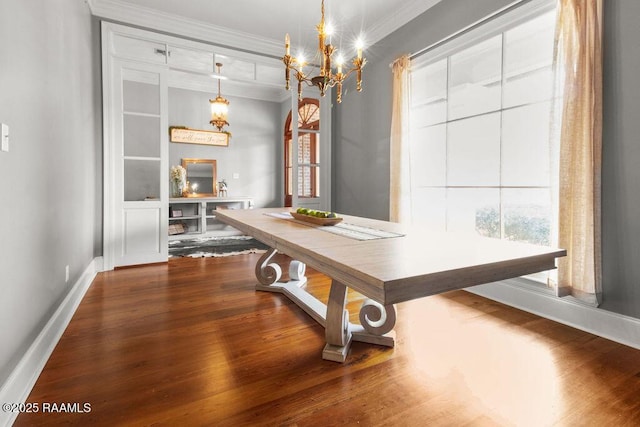 unfurnished dining area featuring an inviting chandelier, hardwood / wood-style floors, and ornamental molding