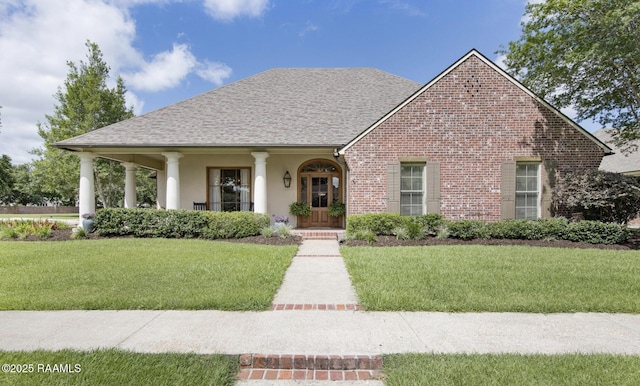 view of front facade with a porch and a front lawn