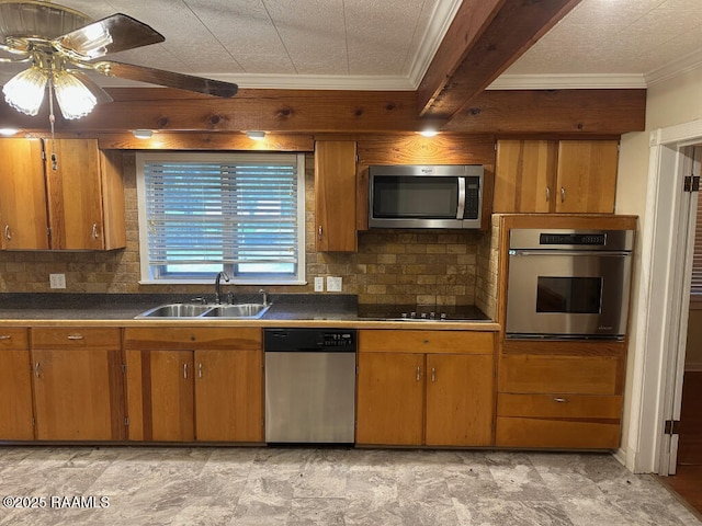 kitchen featuring appliances with stainless steel finishes, sink, decorative backsplash, crown molding, and beam ceiling