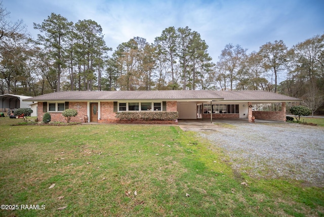 ranch-style home with a front lawn