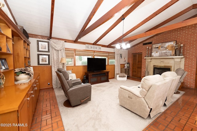 living room featuring a notable chandelier, lofted ceiling with beams, and wood walls