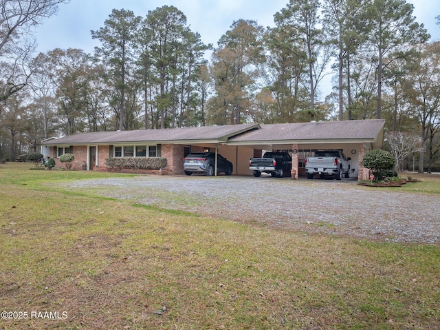 single story home with a front yard and a carport