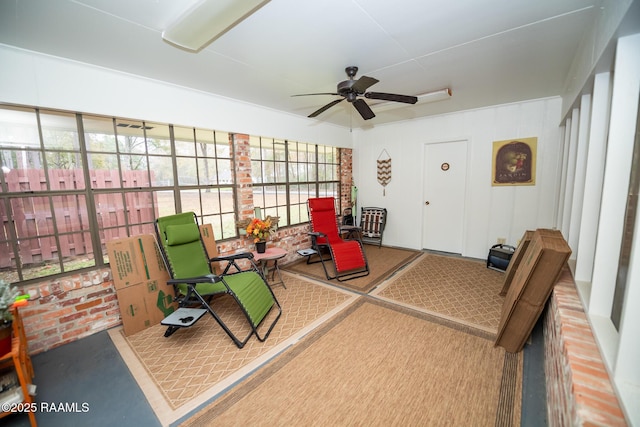 sunroom / solarium with plenty of natural light and ceiling fan