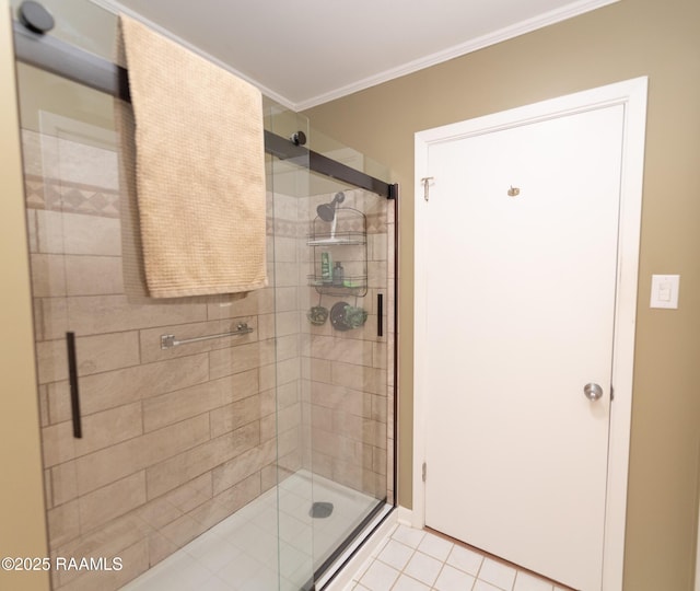 bathroom featuring an enclosed shower, ornamental molding, and tile patterned floors