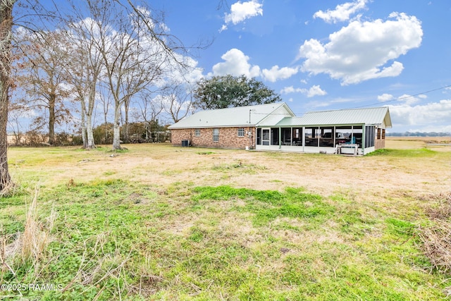 view of yard featuring a sunroom