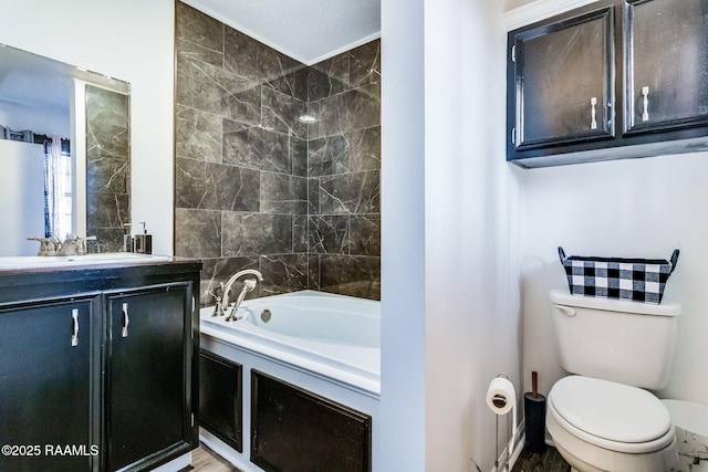 bathroom with vanity, toilet, and a bathing tub