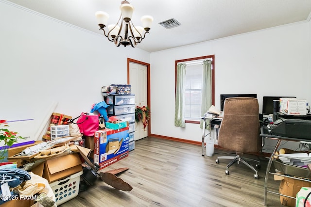 office area featuring an inviting chandelier, crown molding, and light wood-type flooring