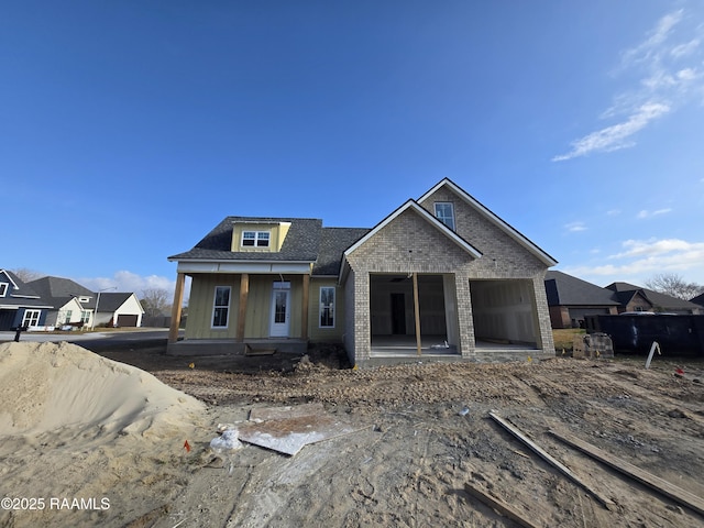 view of front of property featuring a garage and a porch