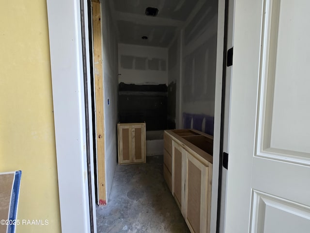 hallway featuring concrete floors