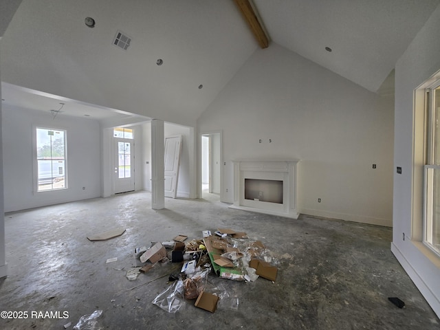 unfurnished living room with high vaulted ceiling, beam ceiling, visible vents, and a fireplace