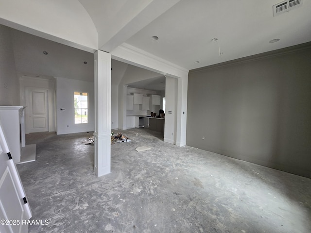 unfurnished living room with visible vents, crown molding, and decorative columns