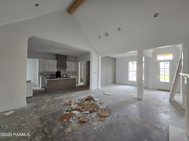 unfurnished living room featuring high vaulted ceiling, visible vents, and beamed ceiling