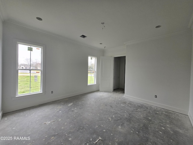 empty room featuring visible vents, baseboards, a wealth of natural light, and ornamental molding