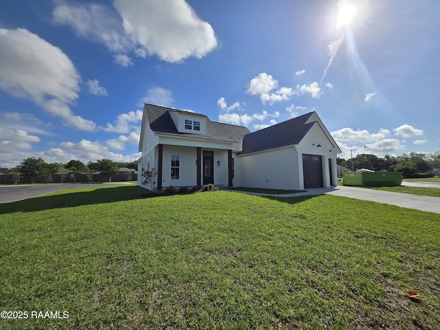 view of front of property featuring driveway, a front yard, and an attached garage