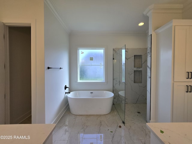 bathroom featuring a freestanding bath, marble finish floor, baseboards, a marble finish shower, and crown molding