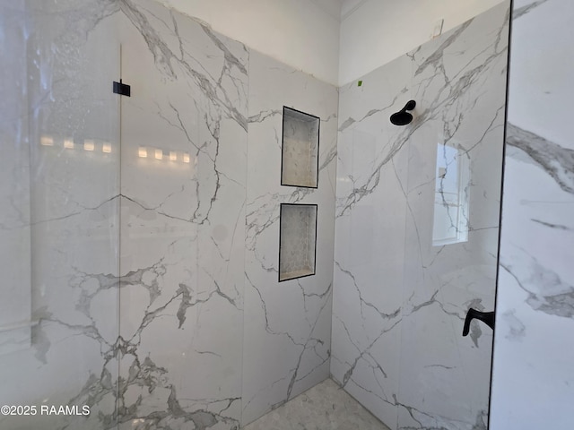 bathroom with a marble finish shower