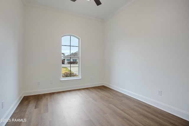 unfurnished room with crown molding, light hardwood / wood-style flooring, and ceiling fan