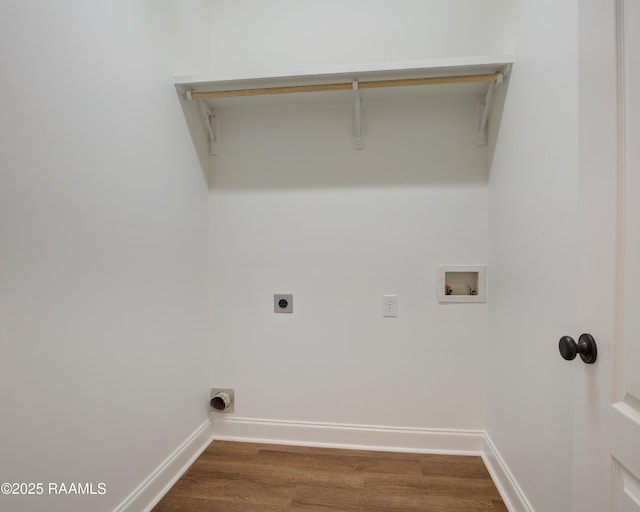 washroom featuring dark wood-type flooring, hookup for an electric dryer, and hookup for a washing machine