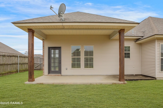 back of house featuring a yard and a patio