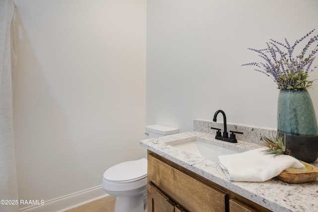 bathroom with vanity and toilet