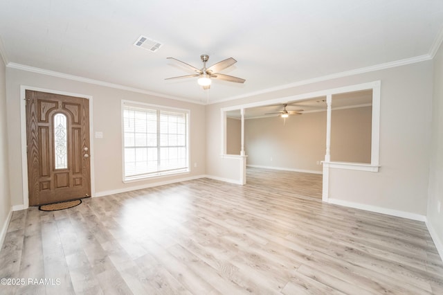 entryway featuring crown molding, ceiling fan, and light wood-type flooring