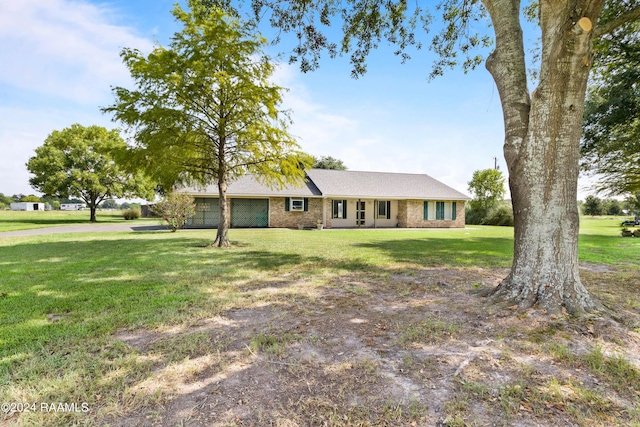 single story home featuring a front yard