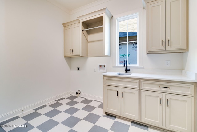 laundry room featuring sink, cabinets, hookup for a washing machine, crown molding, and hookup for an electric dryer