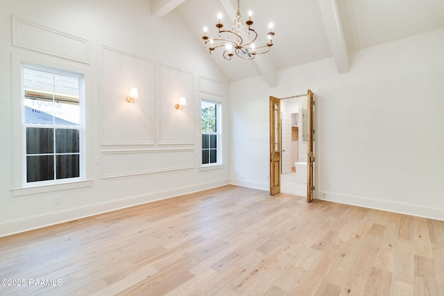 unfurnished room featuring beamed ceiling, high vaulted ceiling, a notable chandelier, and light wood-type flooring