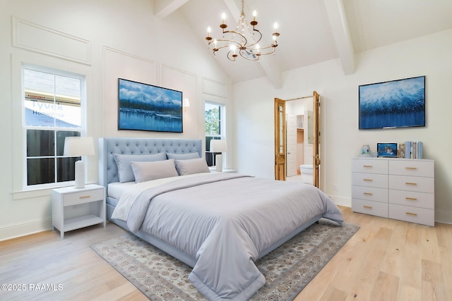 bedroom featuring ensuite bathroom, high vaulted ceiling, a notable chandelier, beamed ceiling, and light hardwood / wood-style floors