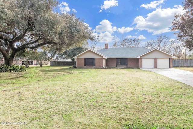 ranch-style house featuring a garage and a front lawn