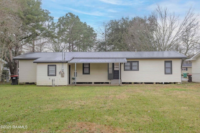 single story home featuring a front lawn