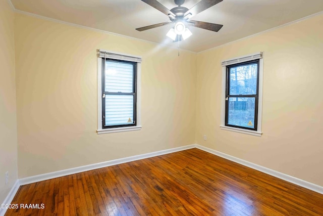 empty room featuring hardwood / wood-style flooring, ceiling fan, and ornamental molding