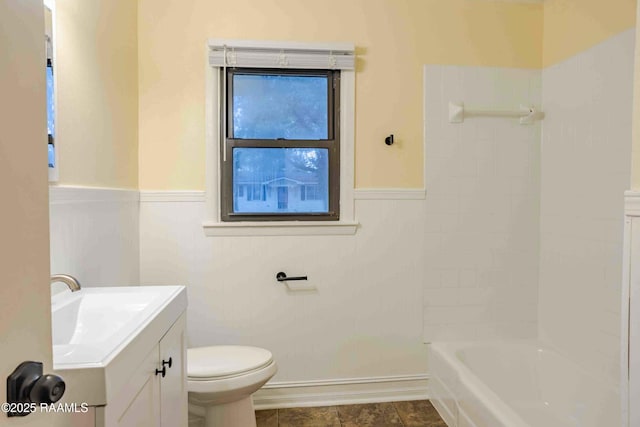 full bathroom featuring vanity, toilet, and washtub / shower combination