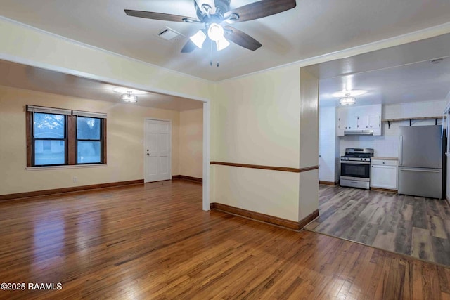 spare room with hardwood / wood-style flooring and ceiling fan