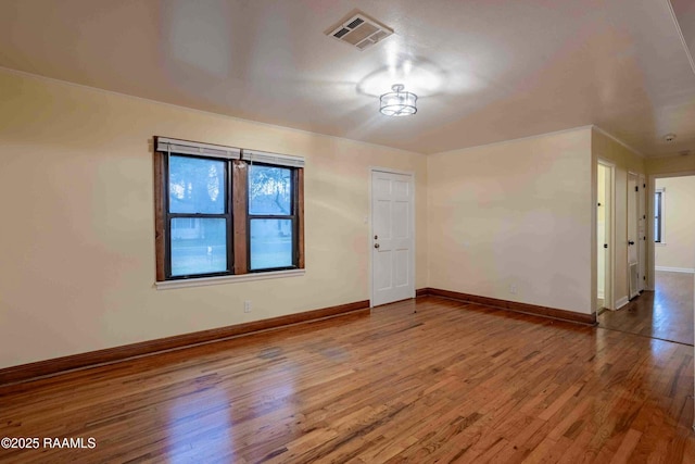 spare room featuring hardwood / wood-style floors