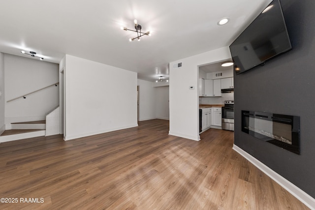 unfurnished living room with light hardwood / wood-style floors