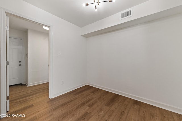 unfurnished room featuring wood-type flooring