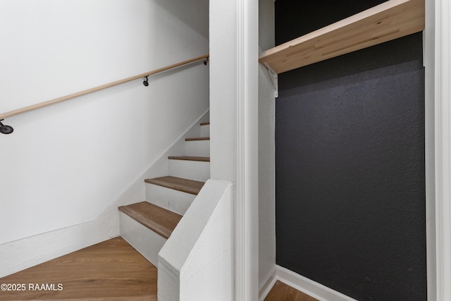 stairway featuring hardwood / wood-style flooring