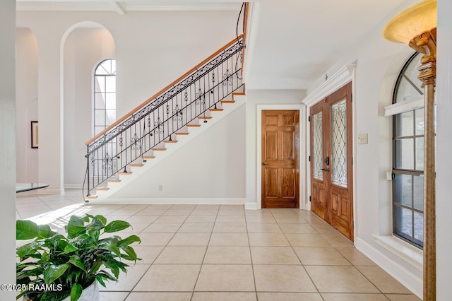 entryway with light tile patterned floors