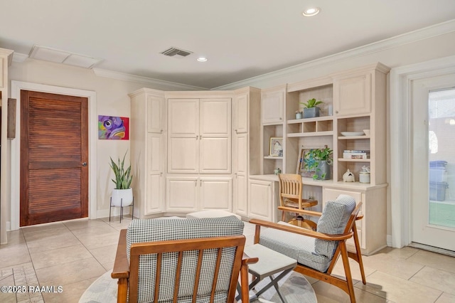 living area with crown molding and light tile patterned floors