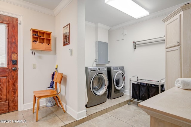 laundry area featuring ornamental molding, light tile patterned floors, electric panel, and independent washer and dryer