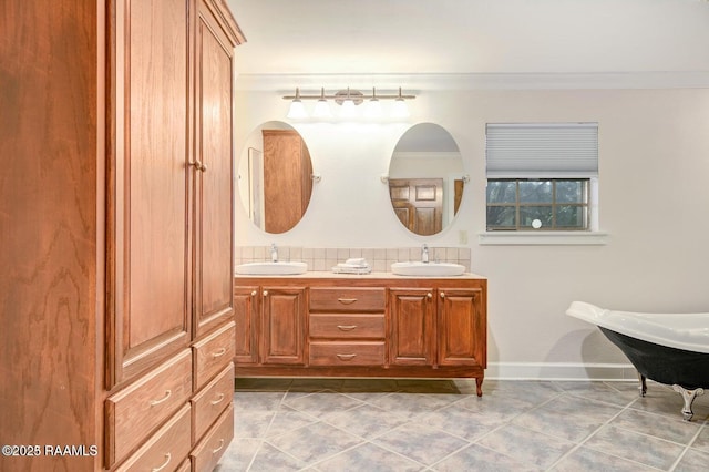 bathroom featuring crown molding, tile patterned floors, and vanity