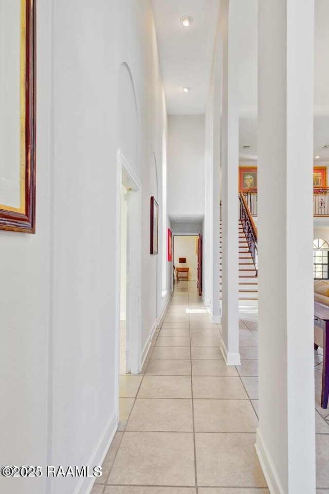 hall with light tile patterned floors