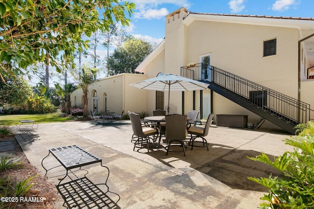 back of property featuring a patio area