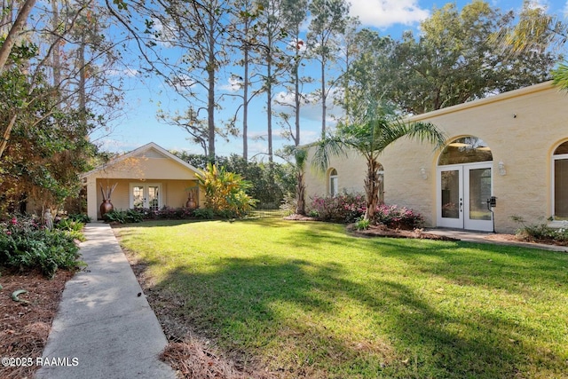 view of yard featuring french doors