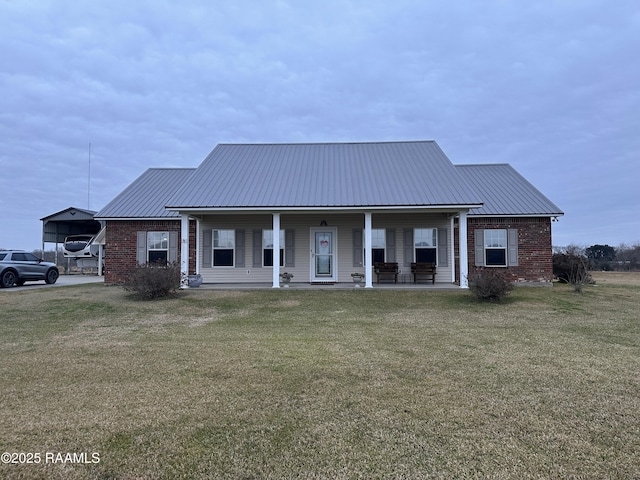 view of front of home with a front yard and a porch