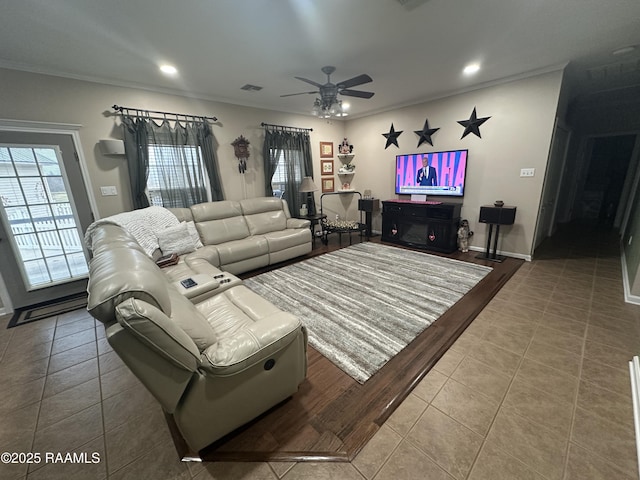 living room with tile patterned flooring, ornamental molding, and ceiling fan