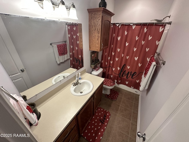 bathroom featuring vanity and toilet