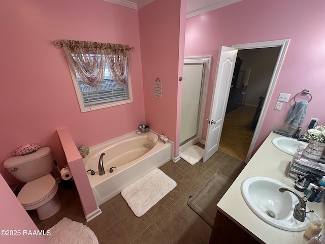 full bathroom featuring vanity, tile patterned flooring, shower with separate bathtub, and toilet