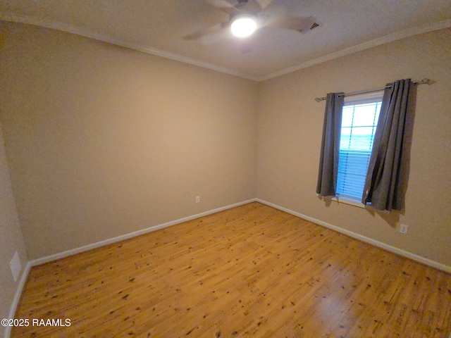 spare room featuring crown molding, ceiling fan, and light hardwood / wood-style flooring